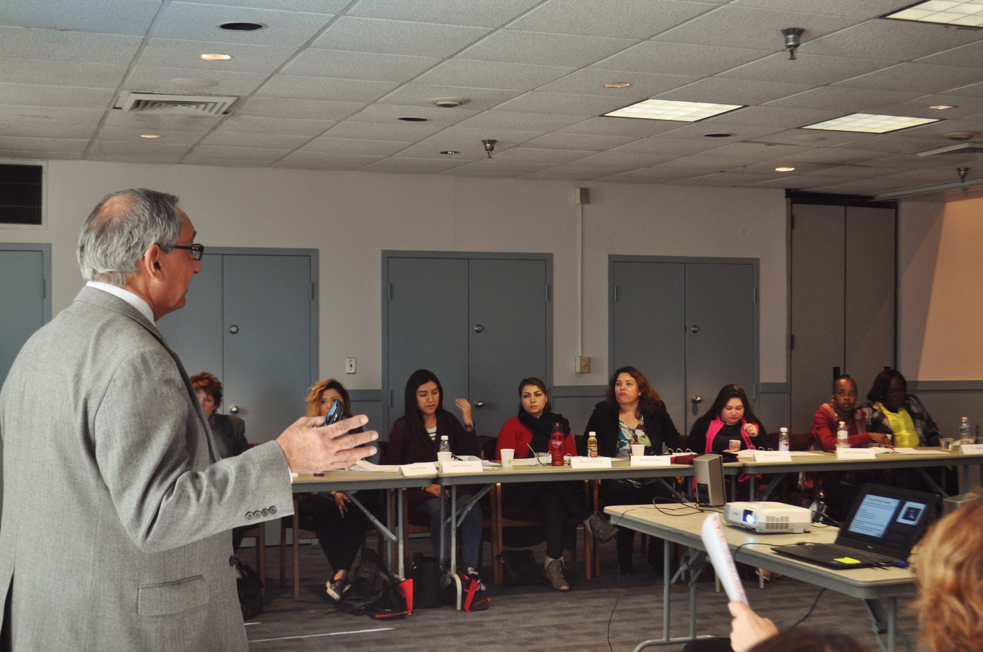 Presenter conducting training to a group of home visitors